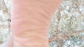 Giantess with her feet up on the table