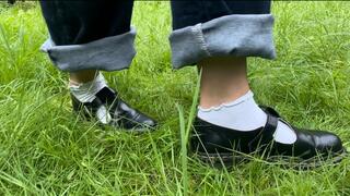 Naughty Amellie gets her feet and socks dirty while walking on the grass