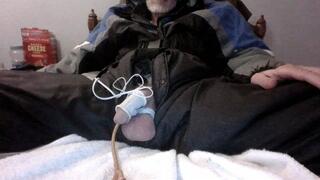Enjoying some estim play with a Foley catheter and anal play