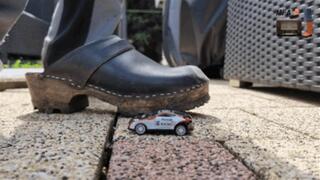 Sheet metal Cars under my cruel wooden Clogs