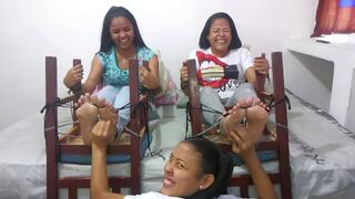 Nicole tickles her mom and sister's feet without a break!