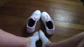 Close up POV trying on shoes