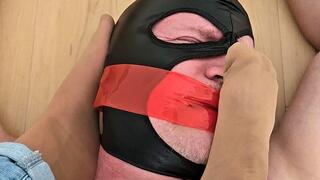 My neighbor lying tied up on the floor under my extremely smelly feet