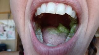 Lania eats a green apple