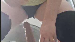 Riding cock on chair puffing cigar