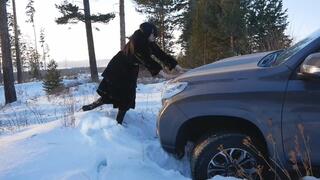 Long-legged hottie drives in the snow and gets her car stuck | Pedal pumping