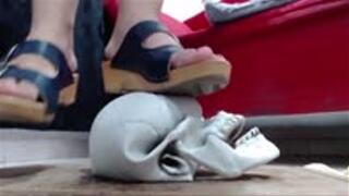 try to press a very hard skull in wooden sandals