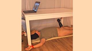 Foot sniffing under table