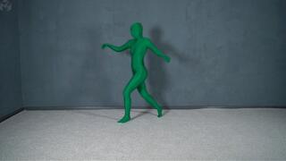 Green man in zentai in transparent vacuum bed with flips and vibration