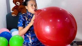 Sexy Camylle Blows To Pop 2 Huge Balloons Dressed In A Traditional Asian Dress