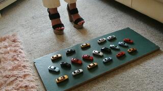GIANTESS Charn crushes 20 tiny toy cars in chunky high heels high left view feet foot toy car crush