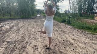 a girl in ballet flats went onto a country road where there is a lot of slippery mud, she slips and her ballet flats are all covered in mud (reupload)