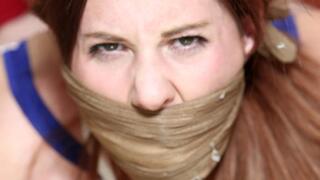 Pantyhose Clad Lilian ends up Tightly Hogtied, Triple Gagged, Groped & Humiliated by a Jilted Co-Worker!