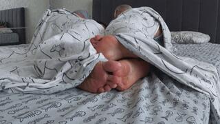 Flirting with legs under the sheets FF