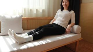 Girl's white cotton socks were tickled after get off work