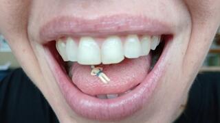 Lania finds a tiny soldier and shrinks him slowly so she can play with him inside her mouth