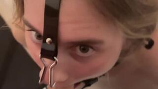 Blowjob with ring gag, nipple clamps and inflatable collar
