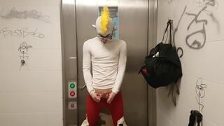 Clown jerking off and putting on condom in public restroom