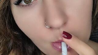 Face close up (sensual smoking) and eye contact