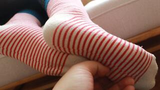 Female doctor's cute cotton socks and bare feet tickling