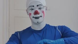 Clown putting on blue rubber gloves