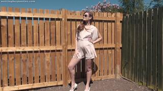 Honour May wets her panties in the garden