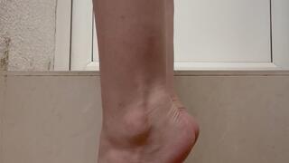 Bare feet with red toenails polish