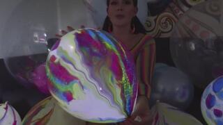 Belle has fun popping light-up balloons