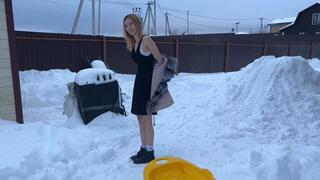 A girl in the -20 frost walks in a light dress and barefoot, she rides down a snow slide (reissue)