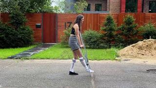 Alena walking on crutches, metal crutches walking, sprained ankle girl, one shoe walk