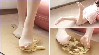 The girl wears pink stockings to show you, and finally crushes the banana into mud