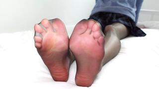 College girl puts on black stockings to show her smooth legs