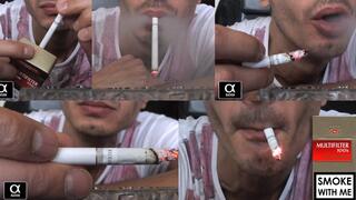 Smoking Multifilter Red 100s leaning on the table