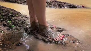Walking barefoot through deep mud and smelly puddles, barefoot in mud, muddy feet