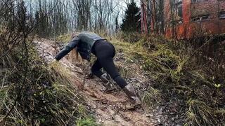 Rubber boots climbing on the slope, rubber boots in mud, hunter boots on muddy slope