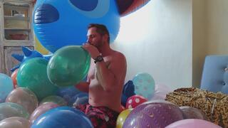 Sebastian blow to pop small balloons and a bigger one