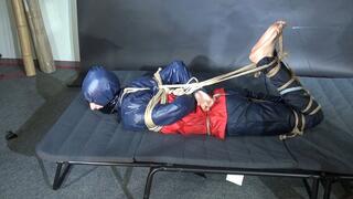 Myxxxy bound and gagged in shiny nylon Rainwear trying to free herself