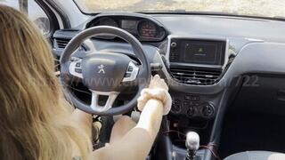 Lou drives an 208 with black sandales