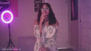 Cute Ebony smoking a cigarette