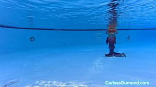 Carissa as a Mermaid in the pool at the resort