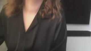 The girl in black smokes and fondles herself