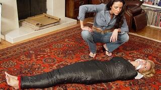 Sly Shamron Stands Back And Watches Barefoot Blonde Hannah Thurman Confined In Black Wrappings!