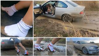 Real estate agent for her powerful BMW stuck in deep mud