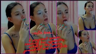 sofia love - A pregnant woman savoring her cigarette, exhaling the smoke gracefully and beautifully