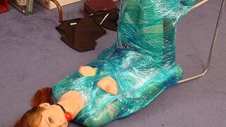 Charlie Laine Is Stuck At Work Wrapped With Plastic To A Chair!