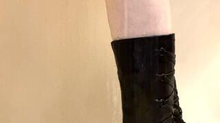 Close up of my black leather boots getting wet in the shower