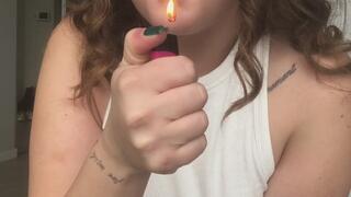 Sexy brunette with big tits smokes