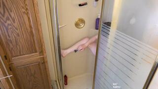 Womab shaving her body in the shower