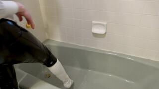 Taking off my shirt and tie while all soaked in the bathtub