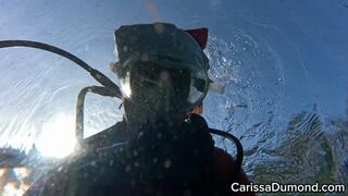 Carissa in the red cat suit scuba diving in the spring